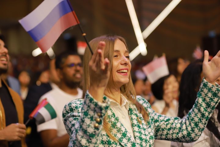 Delegates celebrating together with national flags