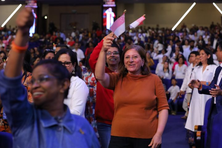 A delegate rejoicing during the service