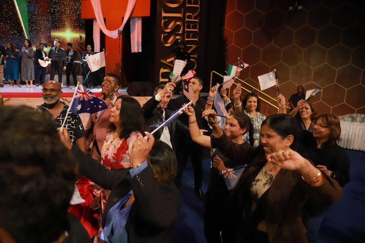 A guest applauding during the gathering